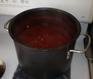 After 12 hours, the sauce is thick and a deep red.